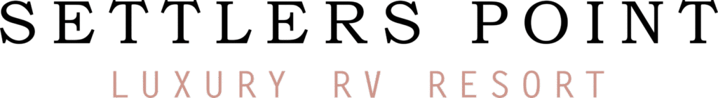 Black serif text reading "SETTLERS POINT" above smaller rose gold colored text reading "LUXURY RV RESORT" centered on white background.