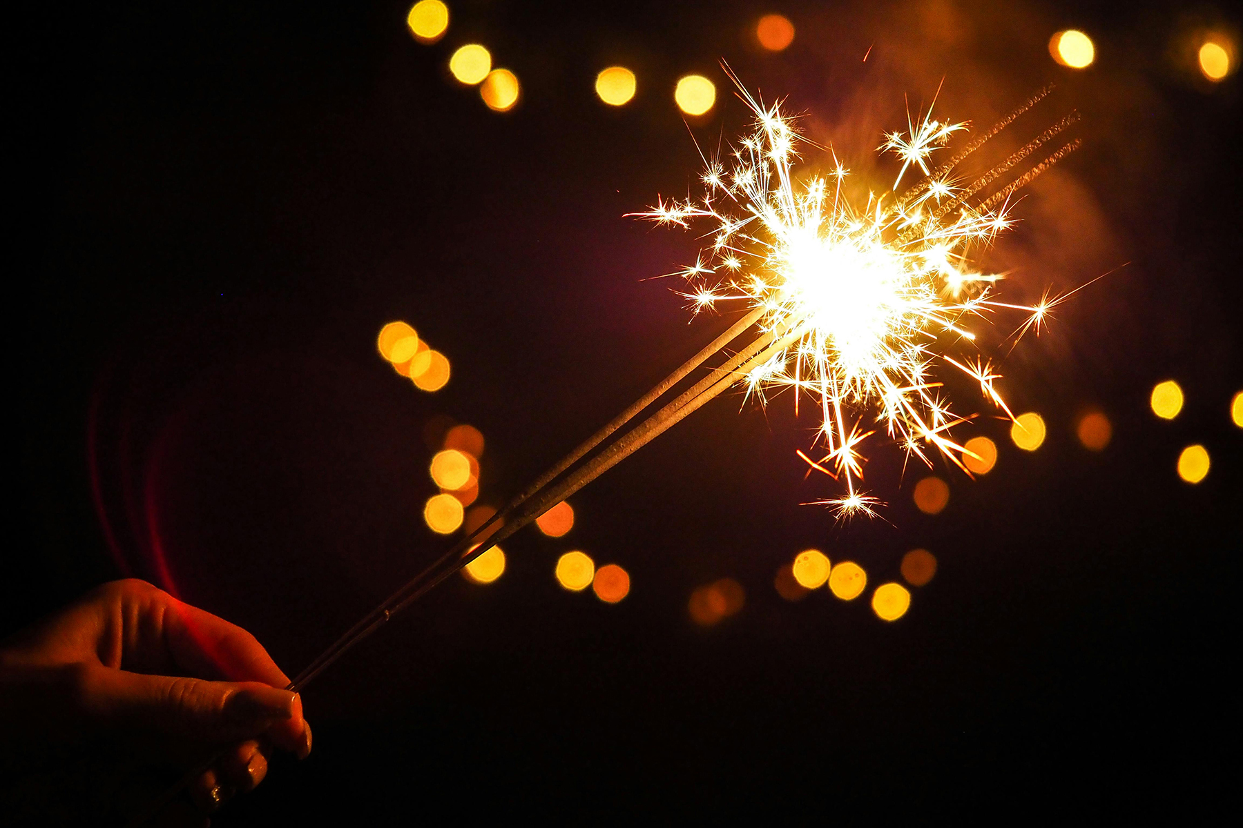 Hand holding bright sparkler during Fourth of July celebration at Settlers Point Luxury RV Resort, by energepic.com (https://www.pexels.com/@energepic-com-27411)