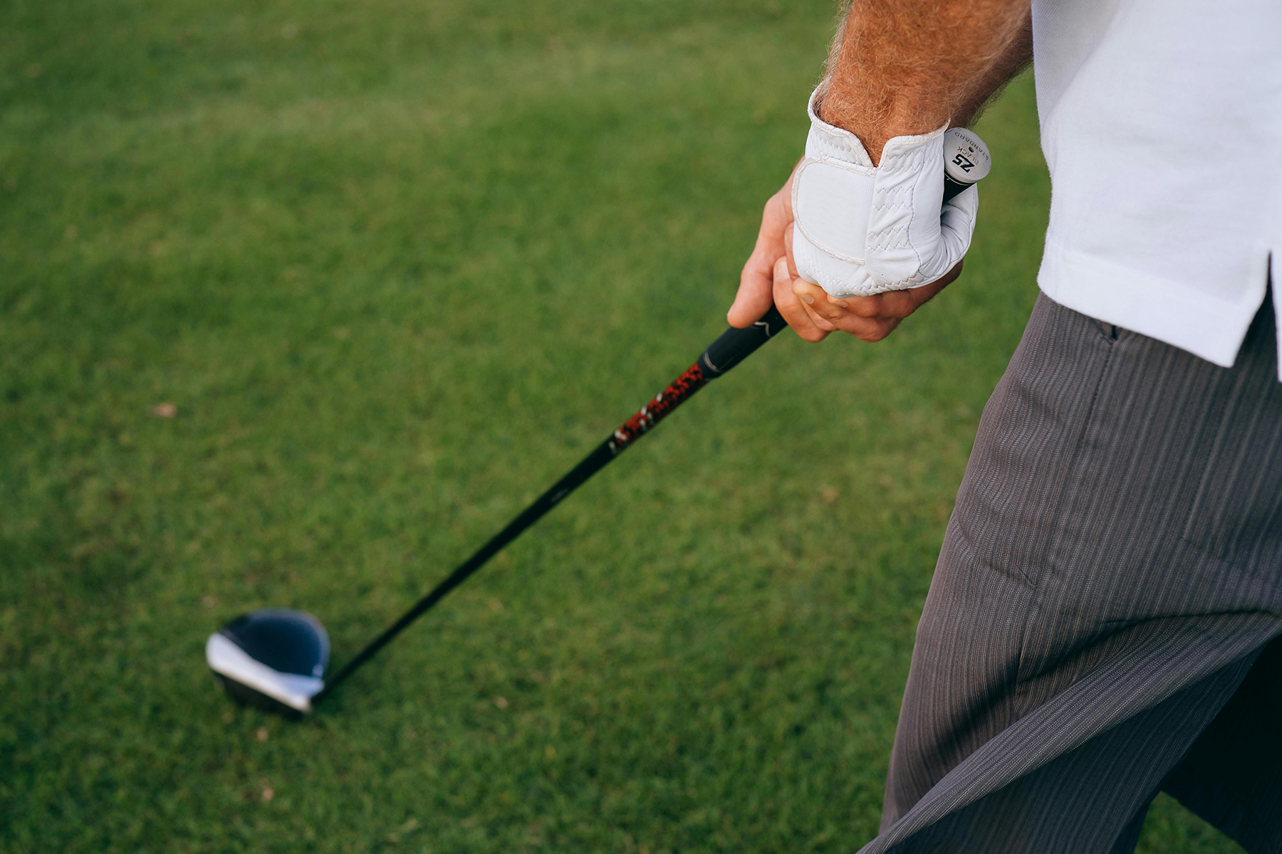 Close-up of golfer preparing to tee off at top golf courses St George Utah by Mikhail Nilov https://www.pexels.com/@mikhail-nilov