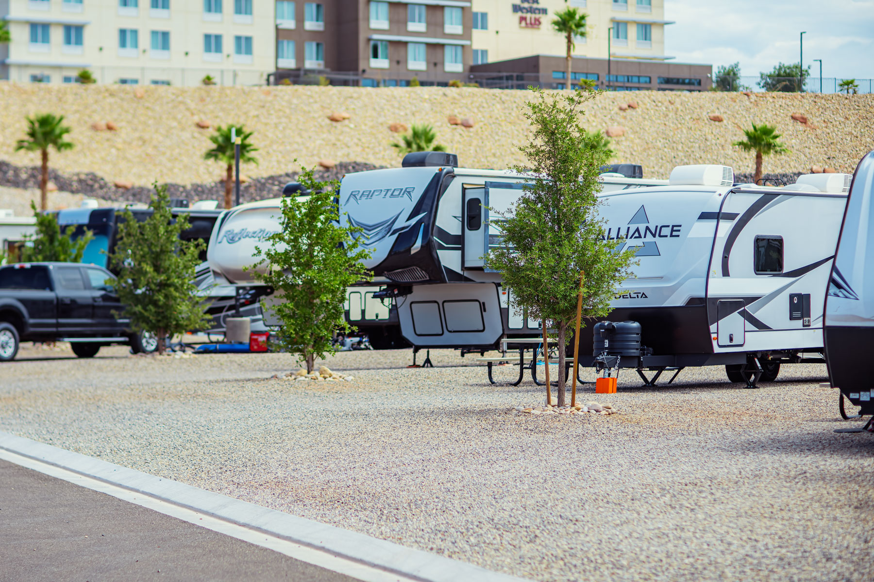 Dog drinking from a pet water station in the dog park at a luxury rv resort, a helpful luxury rv parks amenity.